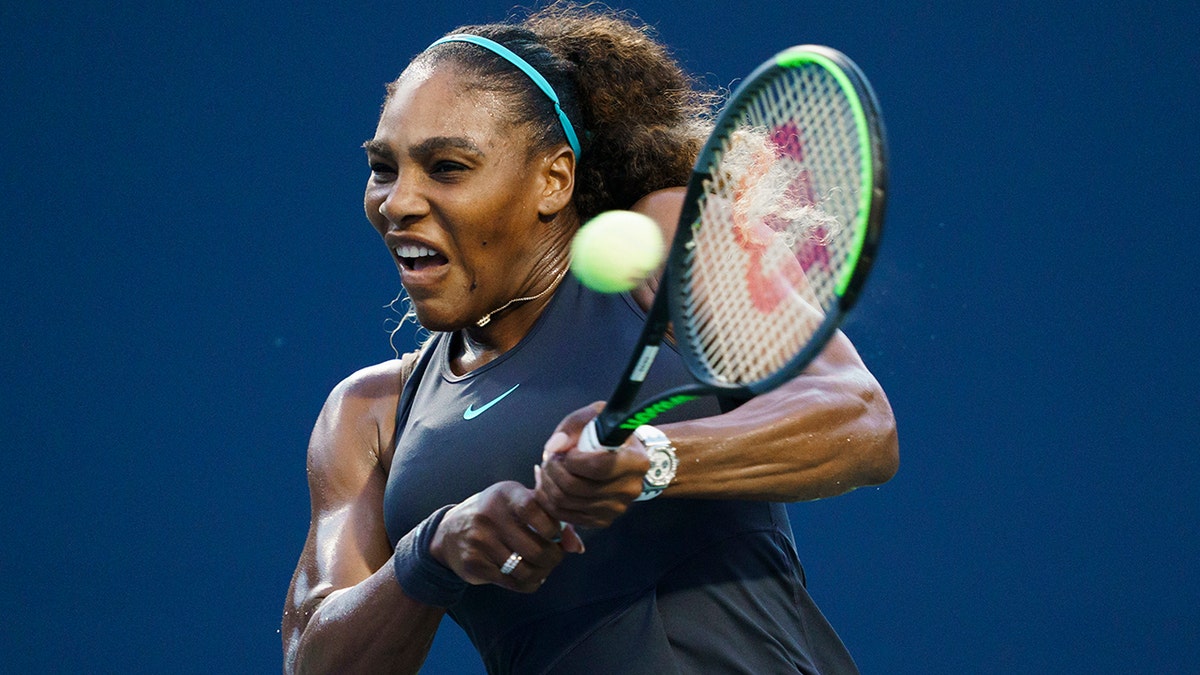 Serena Williams, of the United States, returns a shot to Elise Mertens, of Belgium, during the Rogers Cup women’s tennis tournament Wednesday, Aug. 7, 2019, in Toronto. (Mark Blinch/The Canadian Press via AP)