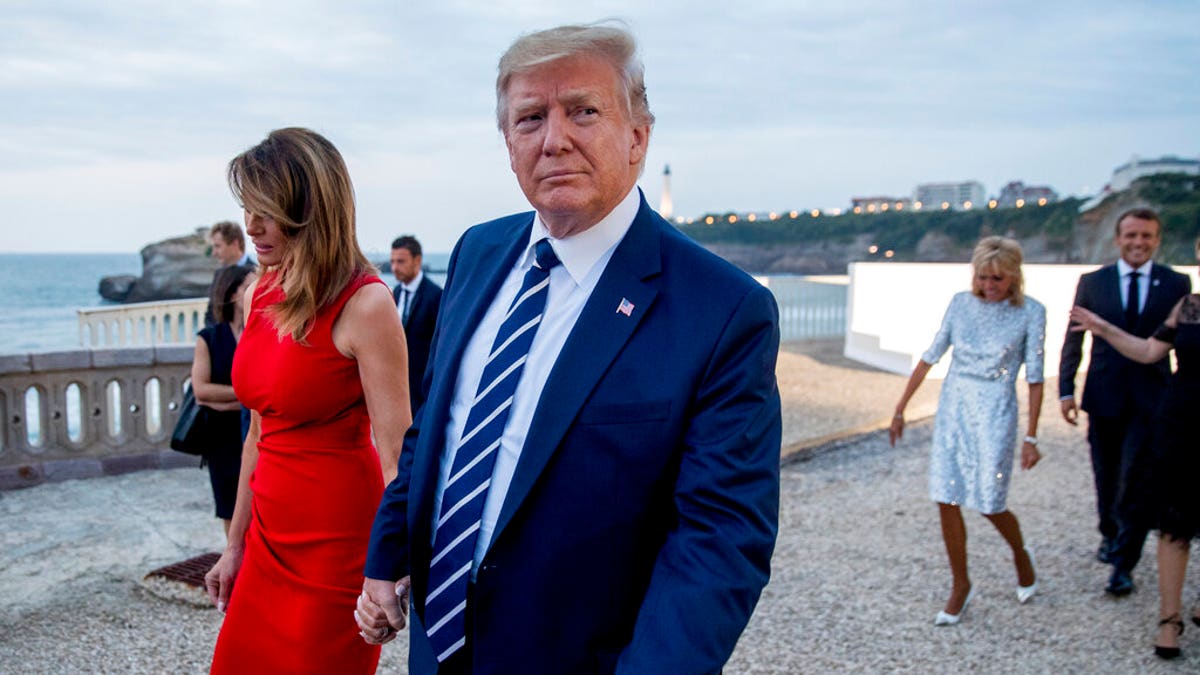 From left, first lady Melania Trump, President Donald Trump, Brigitte Macron and French President Emmanuel Macron depart following the Group of Seven leaders G-7 family photo with guests at the G-7 summit at the Hotel du Palais in Biarritz, France, Sunday, Aug. 25, 2019. (AP Photo/Andrew Harnik)