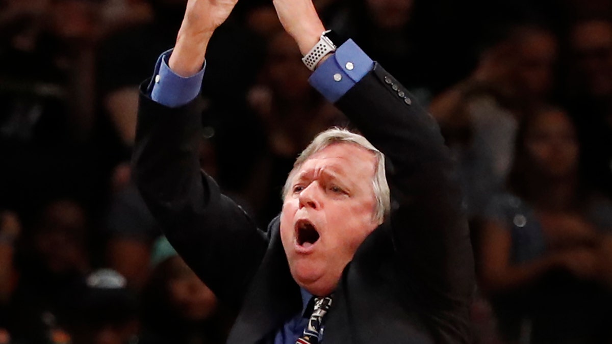 Seattle Storm head coach Dan Hughes signals a time out during the fourth quarter of a WNBA basketball game against the New York Liberty, Sunday, Aug. 11, 2019, in New York. The Storm defeated the Liberty 84-69.(AP Photo/Kathy Willens)