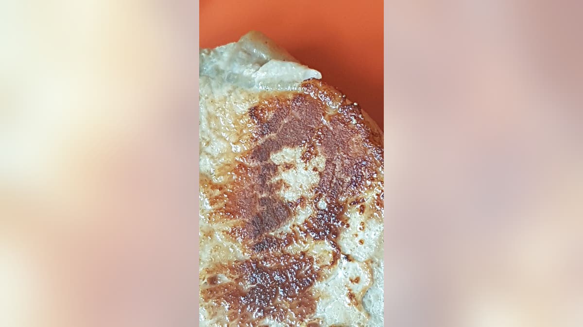 A dad was left starstruck after Queen frontman Freddie Mercury seemingly appeared in his pork chop.