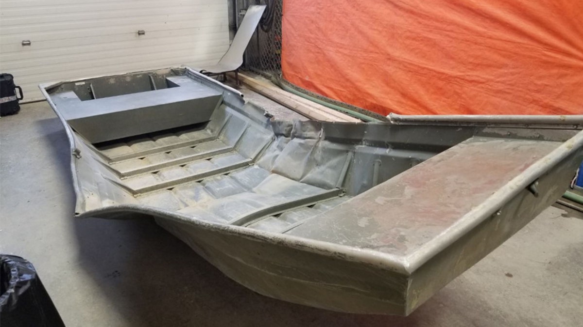 A damaged aluminum boat was discovered on the shore of the Nelson River in northern Manitoba on Friday.
