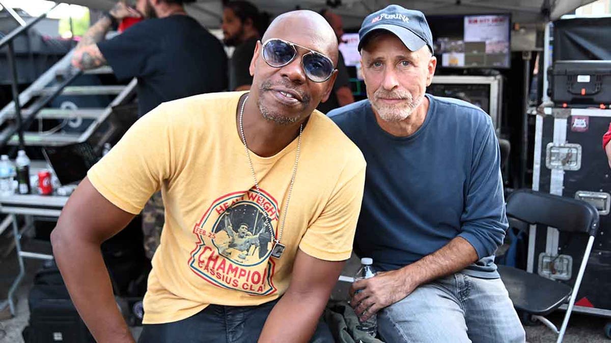 DAYTON, OHIO - AUGUST 25:   Dave Chappelle and John Stewart pose backstage during Dave Chappelle's Block Party on August 25, 2019 in Dayton, Ohio. (Photo by Stephen J. Cohen/Getty Images)