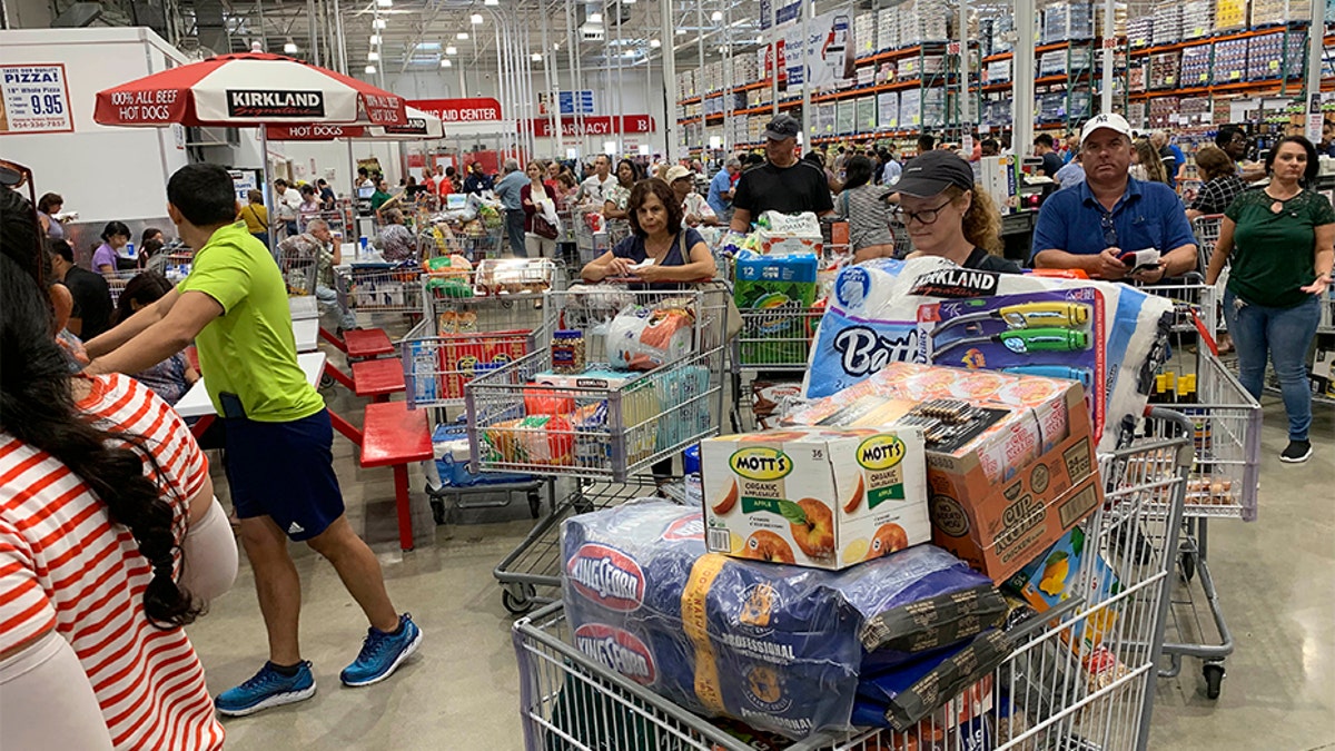 Shoppers wait in long lines at Costco, Thursday, in Davie, Fla., as they stock up on supplies ahead of Hurricane Dorian. (AP)