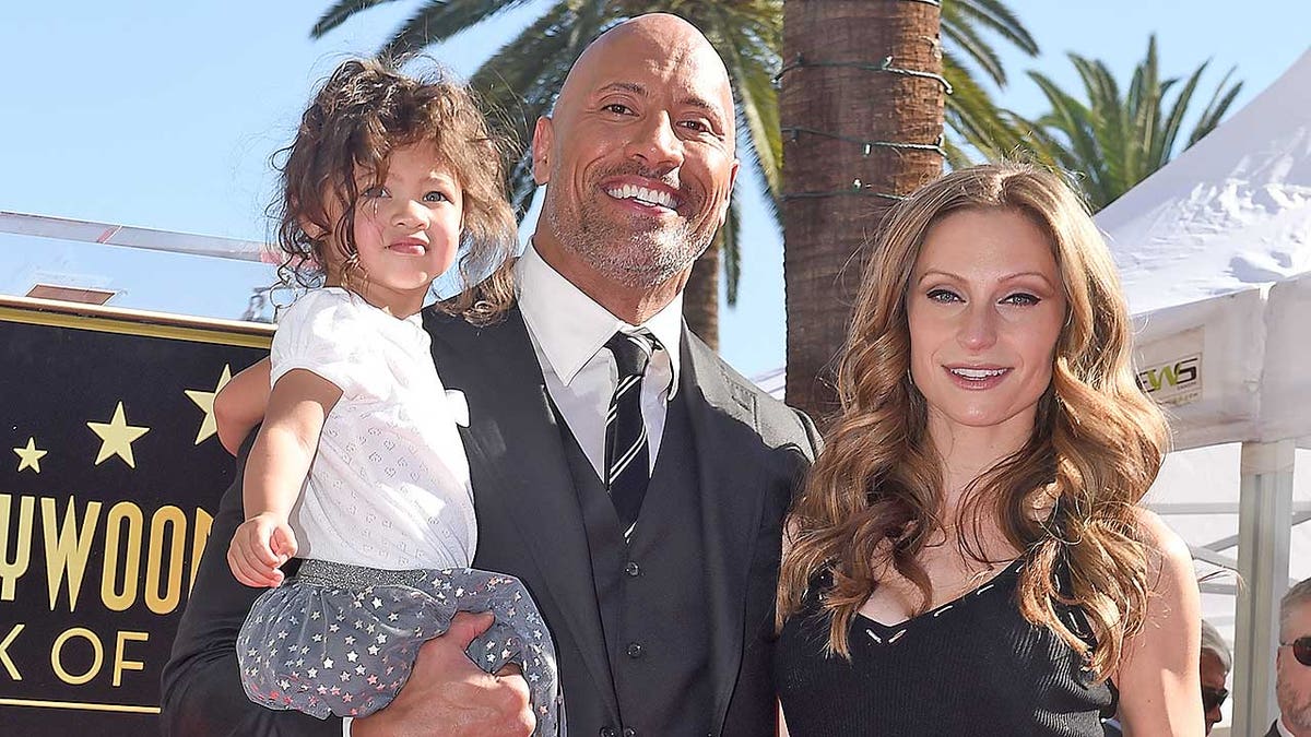 HOLLYWOOD, CA - DECEMBER 13: Actor Dwayne Johnson, wife Lauren Hashian and daughter Jasmine Johnson attend the ceremony honoring Dwayne Johnson with star on the Hollywood Walk of Fame on December 13, 2017 in Hollywood, California. (Photo by Axelle/Bauer-Griffin/FilmMagic)