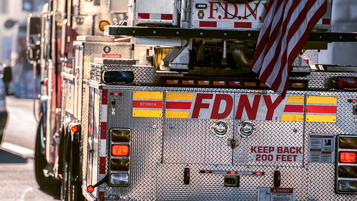 FDNY Ladder truck going for rescue with firemen