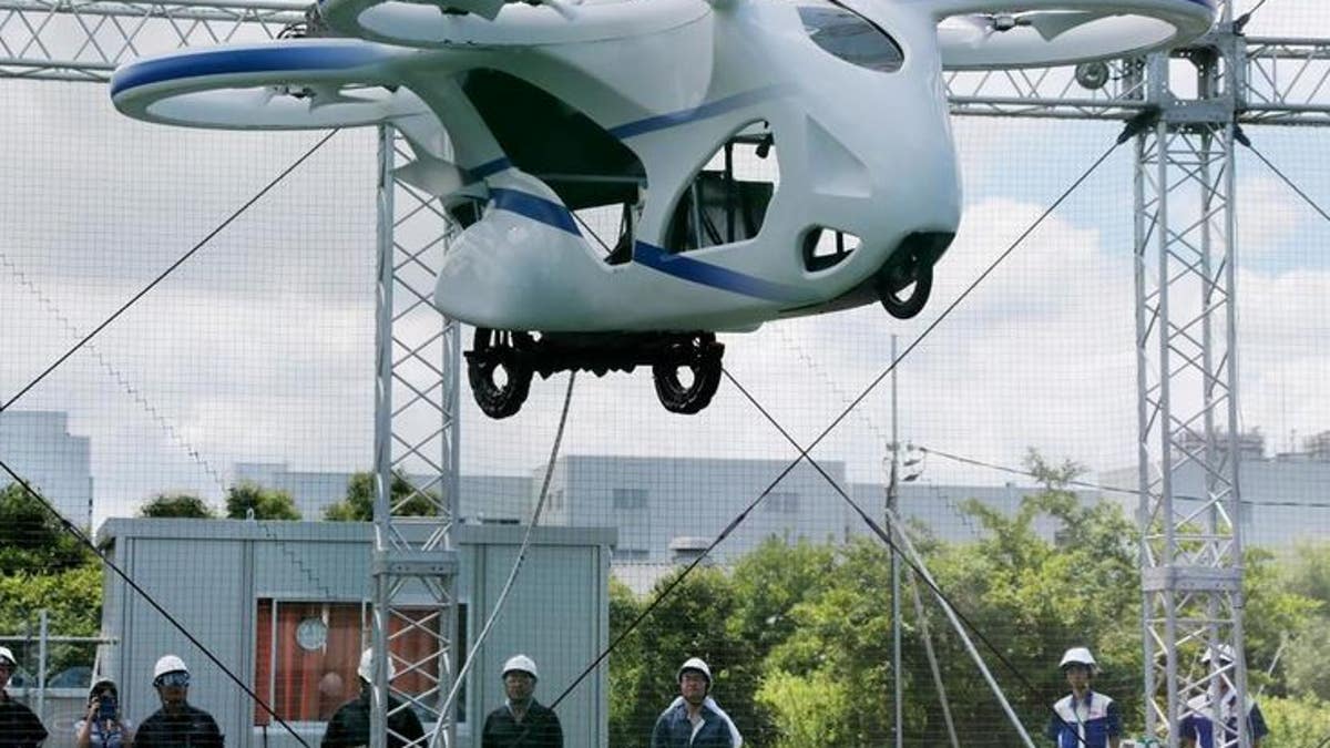 NEC Corp.'s machine with propellers hovers at the company's facility in Abiko near Tokyo, Monday, Aug. 5, 2019.