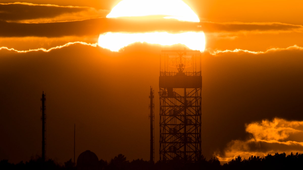 The radar tower of Tegel Airport is pictured in front of the setting sun on March 19, 2019, in Berlin, Germany.