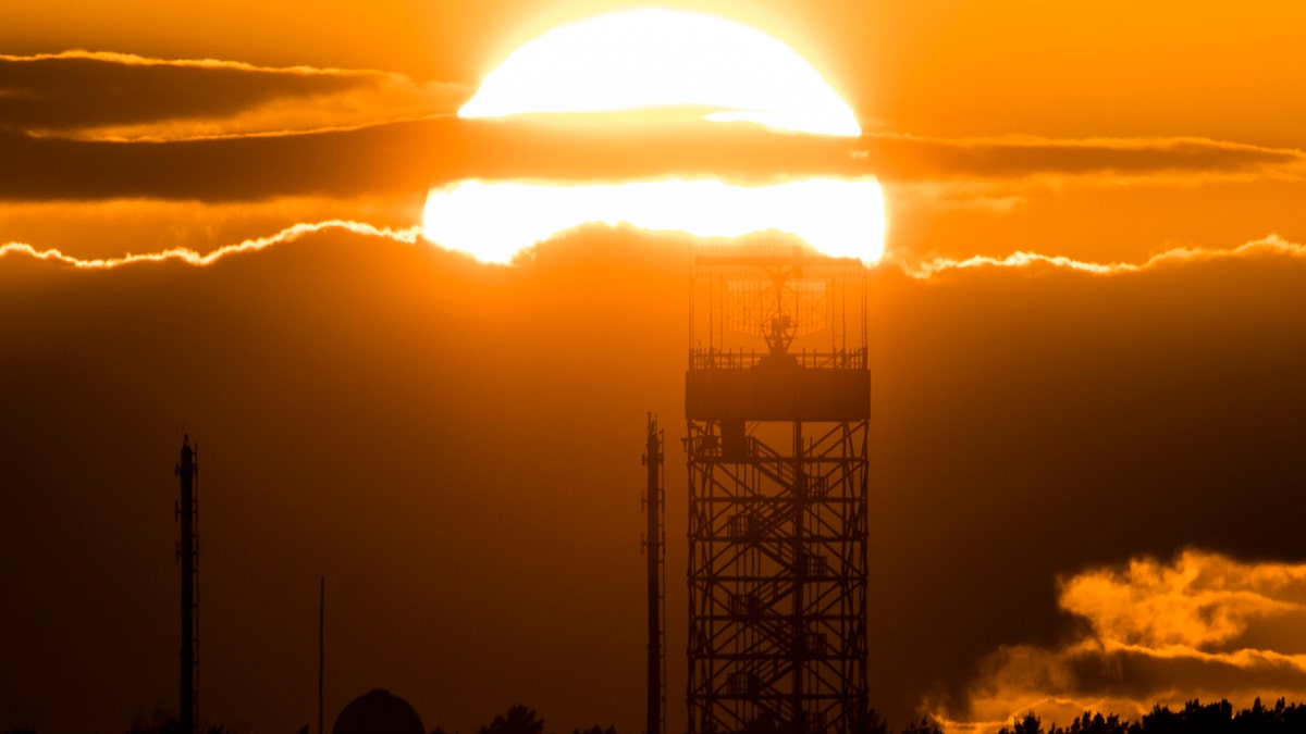 The radar tower of Tegel Airport is pictured in front of the setting sun on March 19, 2019, in Berlin, Germany.
