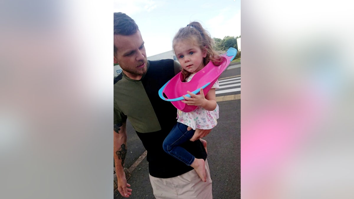 "I thought it would just come off but her ears kept getting in the way and she was getting so mad at me," her father said. (SWNS)