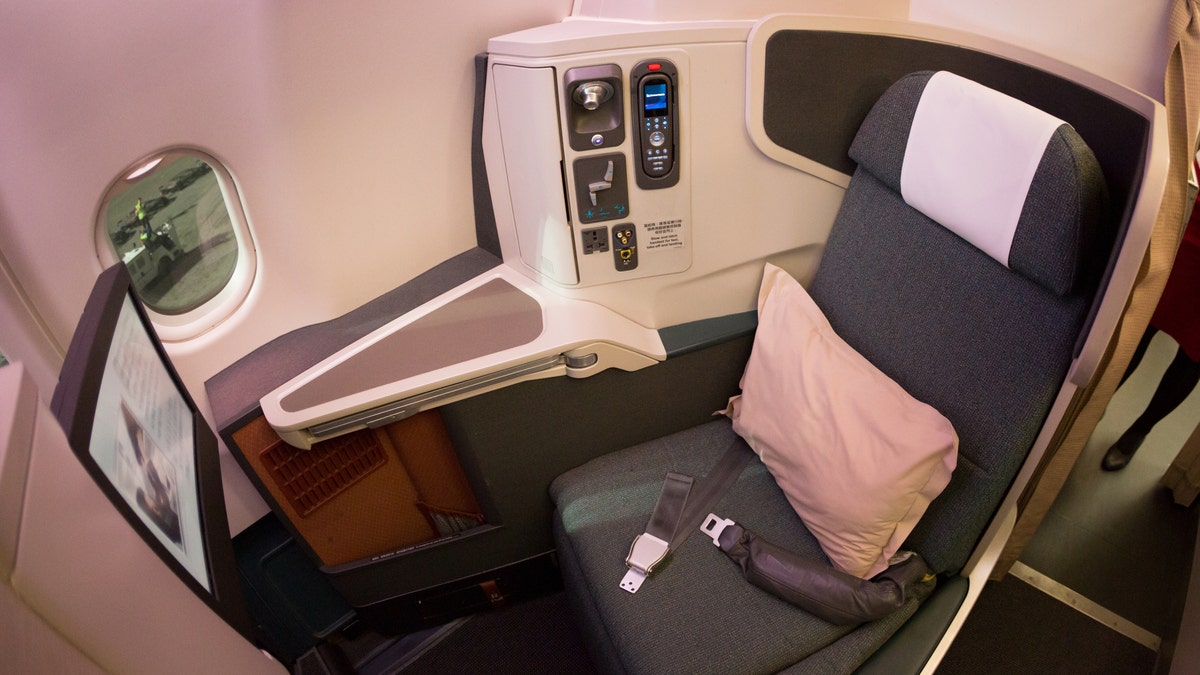 An interior shot of a Cathay Pacific Airbus A330-300, business class cabin.