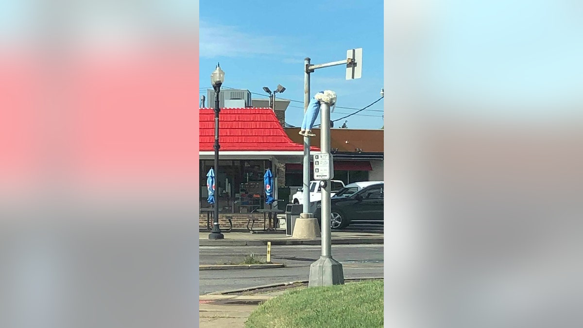 A creepy doll hanging from a light pole in Festus, Missouri.