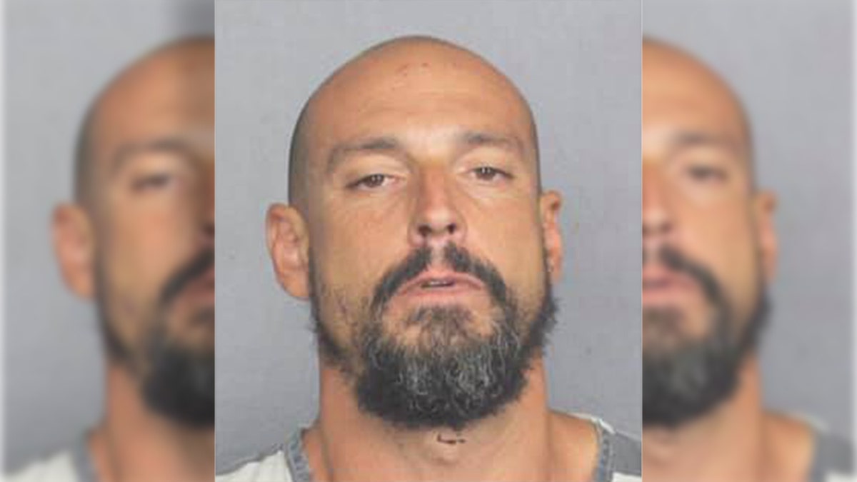 Mugshot for "John Smith," a man who refused to divulge his name after police accused him of pedaling a bike around Wilton Manners, Fla., in the nude, before stealing underwear.