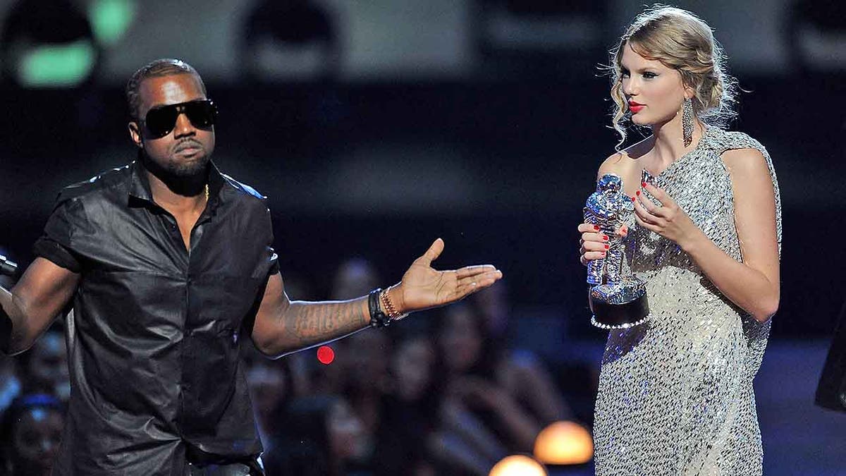 NEW YORK - SEPTEMBER 13: Kanye West takes the microphone from Taylor Swift and speaks onstage during the 2009 MTV Video Music Awards at Radio City Music Hall on September 13, 2009 in New York City. (Photo by Kevin Mazur/WireImage)