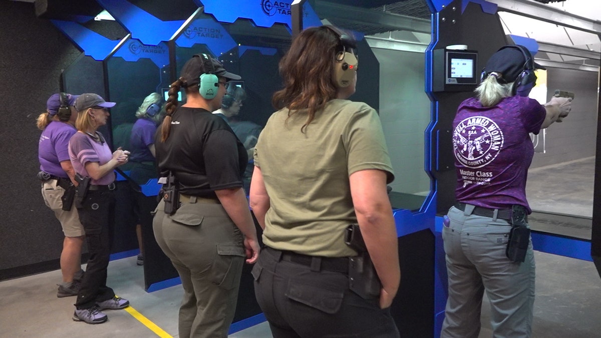 Members of the Well Armed Woman practice shooting at C2 Tactical, in Scottsdale Arizona.