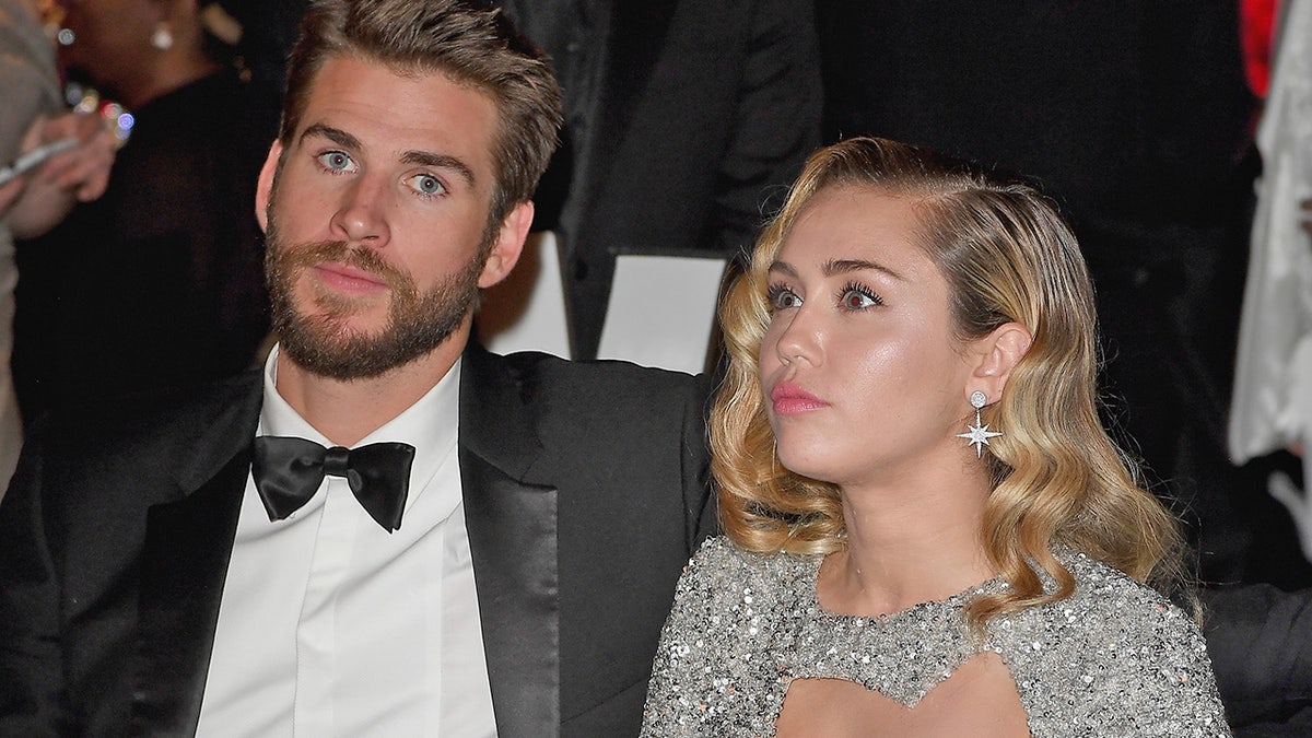 LOS ANGELES, CA - MARCH 04: Liam Hemsworth (L), and Miley Cyrus attends Elton John AIDS Foundation 26th Annual Academy Awards Viewing Party at The City of West Hollywood Park on March 4, 2018 in Los Angeles, California. (Photo by Venturelli/Getty Images for Bulgari)