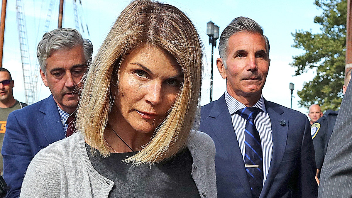 Lori Loughlin and husband Mossimo Giannulli leave the John Joseph Moakley United States Courthouse in Boston on Aug. 27, 2019. Giannulli, 57, is currently serving his five-month prison sentence in Lompoc, Calif.
