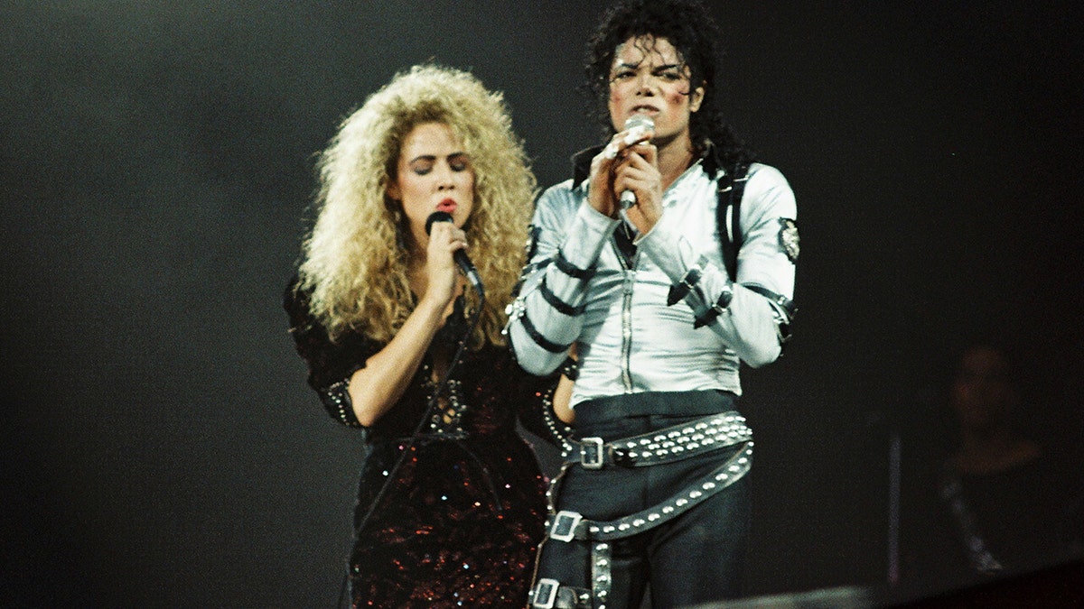 FILE - Sheryl Crow (L) joins Michael Jackson (R) to perform on stage on his BAD tour at Wembley Stadium on 23rd July 1988 in London, United Kingdom. (Photo by Pete Still/Redferns)