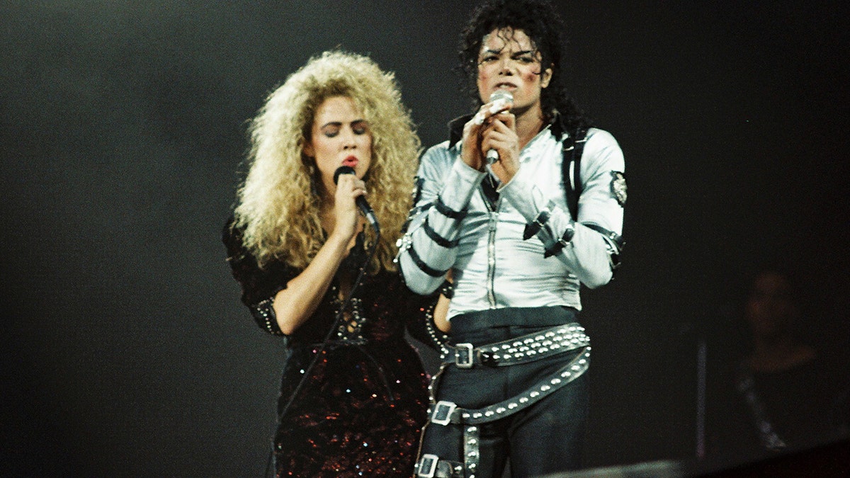 Before Sheryl Crow (left) was famous, she was a backup singer for Michael Jackson (right) during his Bad World Tour in the late 1980s. (Pete Still/Redferns)