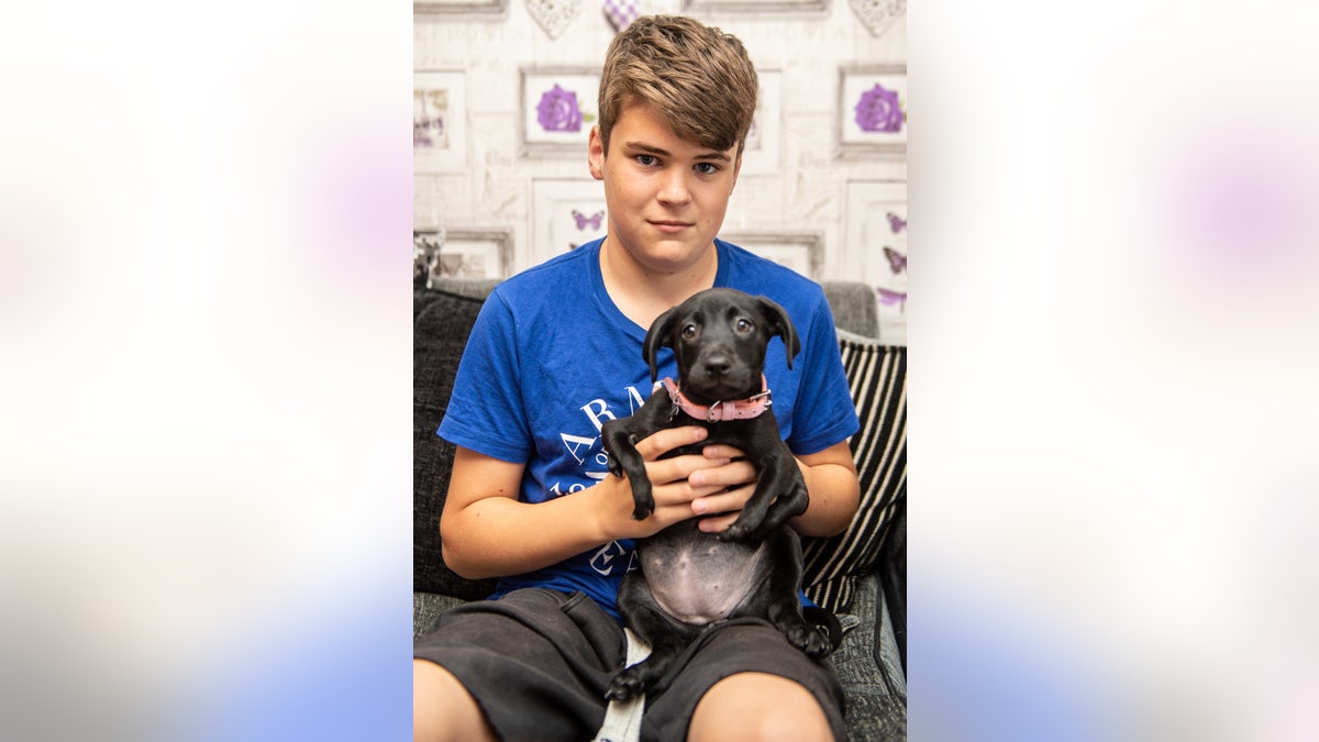 Luke Salmon, pictured, recently adopted special pup Roo from breeders in Essex, England.