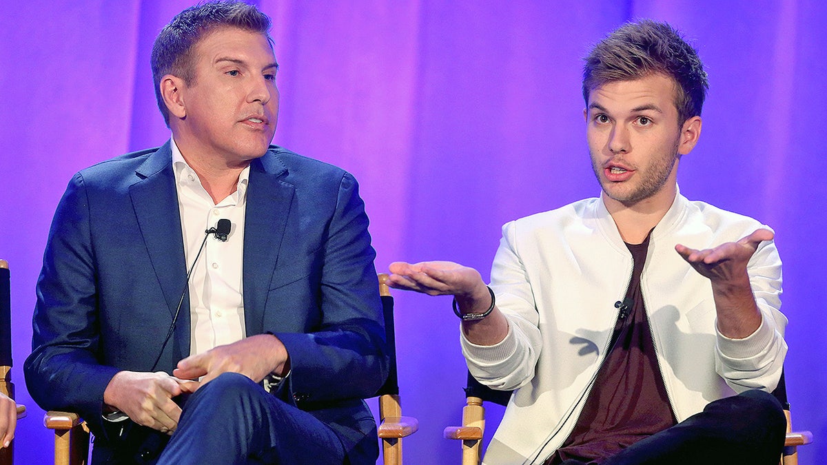 Producer/TV personality Todd Chrisley and son Chase Chrisley speak onstage during the 