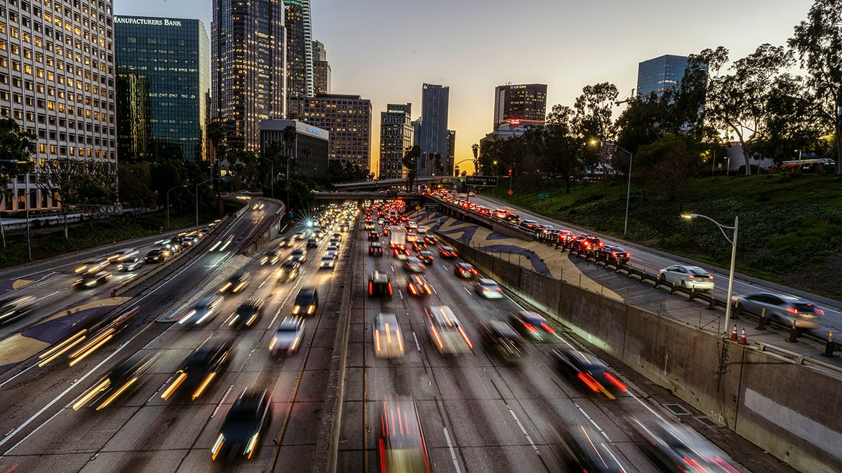 FILE –Los Angeles, Calif.: A view of downtown Los Angeles skyline and traffic on the 110 Free-way. (Photo by Ronen Tivony/SOPA Images/LightRocket via Getty Images)