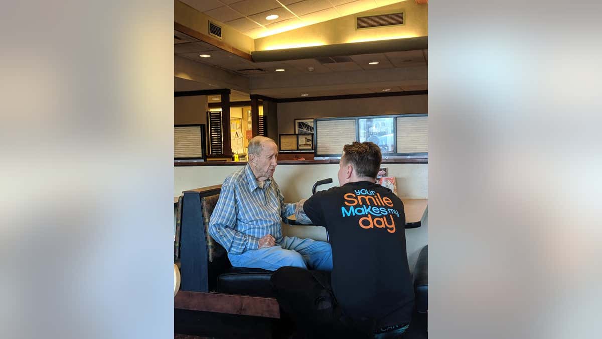 Lisa Meilander said at first her family didn't see the older man come in, but took notice when their waiter, Dylan Tetil, 24, got down on one knee to talk to the man “eye-to-eye.”