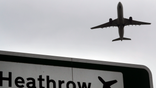 FILE - In this file photo dated Tuesday, June 5, 2018, a plane takes off over a road sign near Heathrow Airport in London. Heathrow Airport officials and union leaders are holding last-ditch talks in hopes of averting a strike at Europe’s busiest airport. Security guards, firefighters, engineers and drivers at Heathrow plan to go on strike at one minute after midnight if negotiations on Sunday, Aug. 4, 2019 fail. The airport cancelled more than 170 flights scheduled for Monday and Tuesday in preparation. Members of the union Unite have voted to reject an offer Heathrow officials said provided a 7.3% pay increase over 2½ years. (AP Photo/Kirsty Wigglesworth, file)