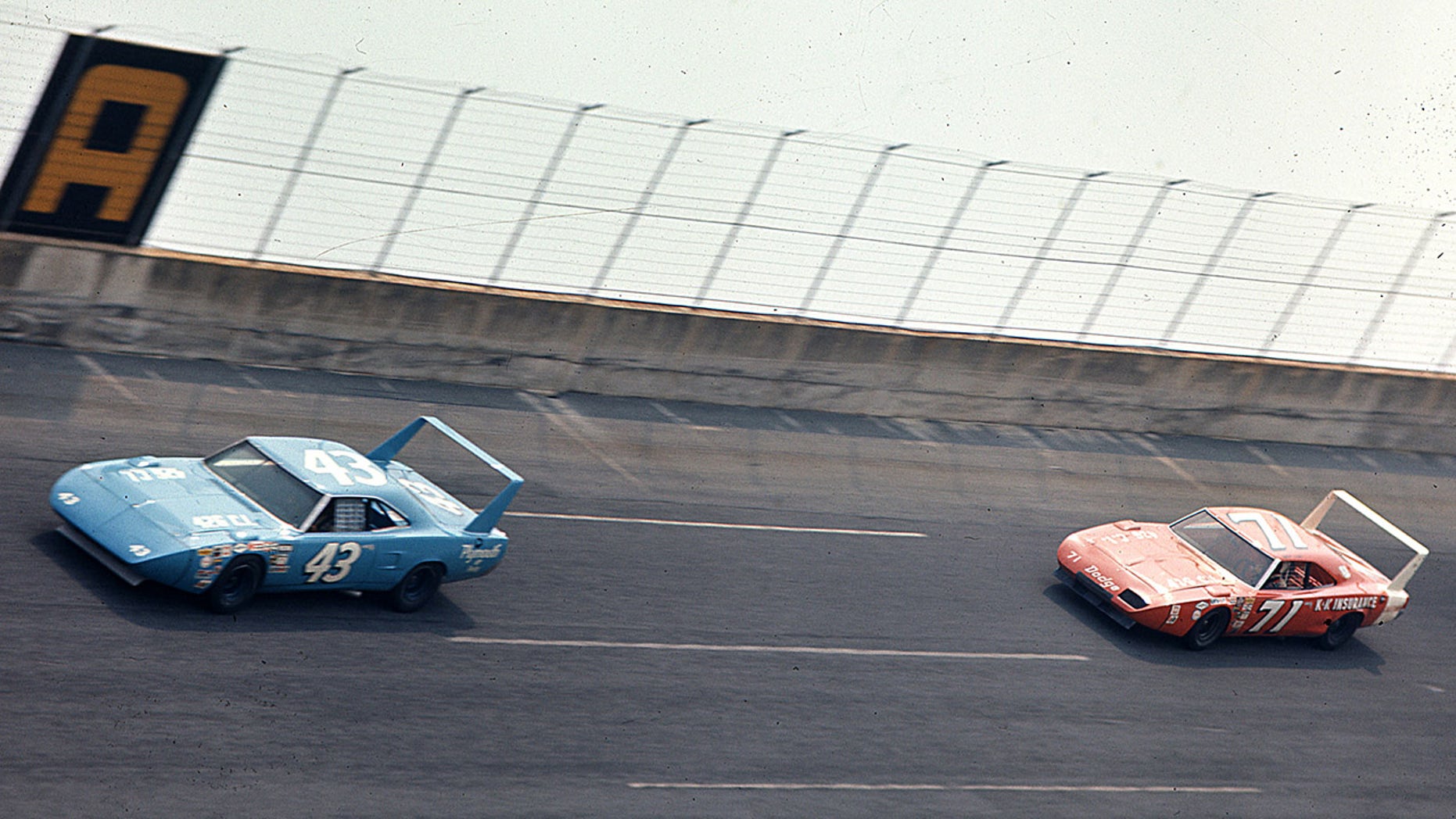 Richard Petty leads Bobby Isaac during the 1970 Firecracker 400 NASCAR Cup race at Daytona International Speedway.