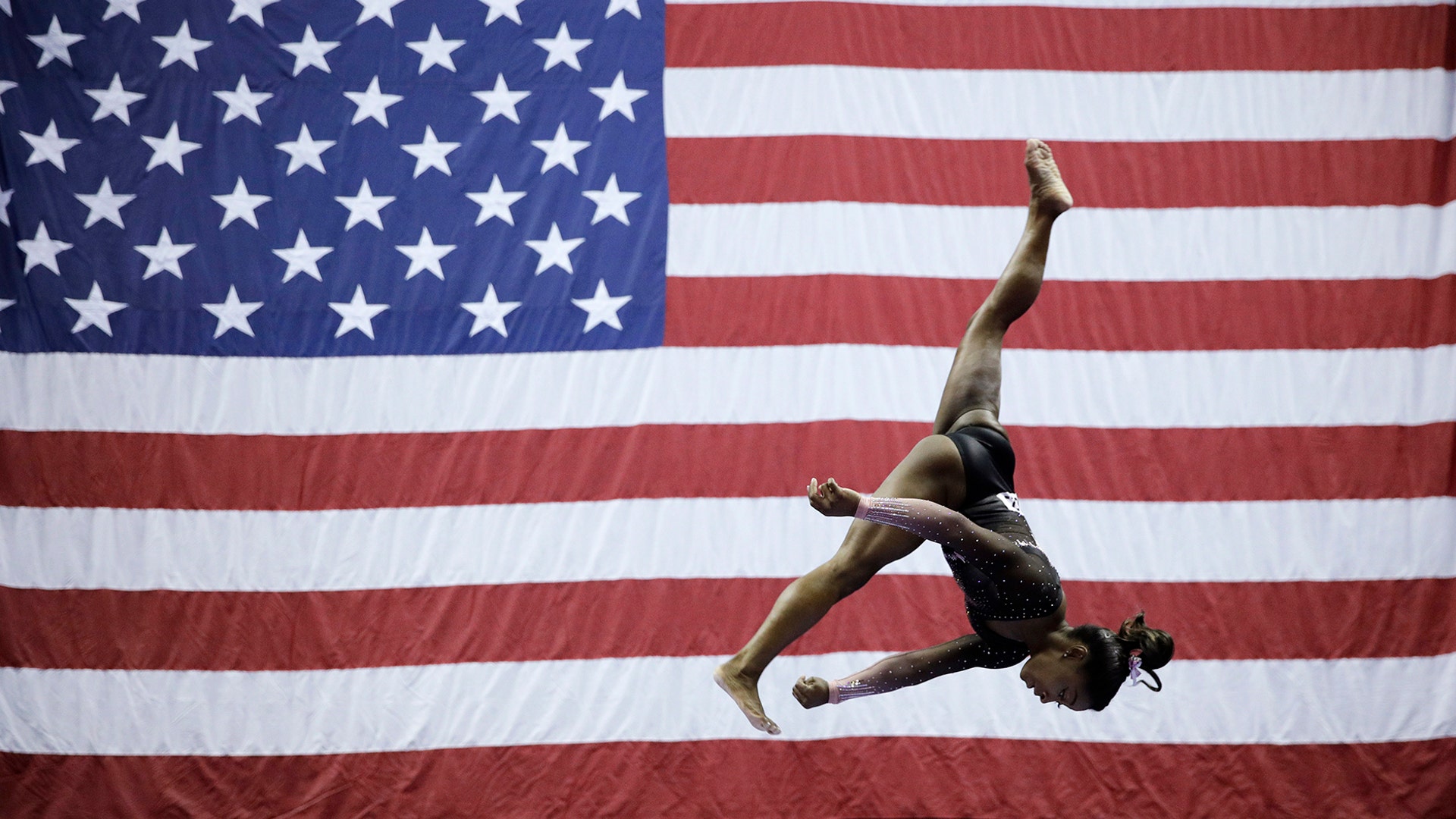 Simone Biles competes on the beam during the senior women's competition at the 2019 U.S. Gymnastics Championships in Kansas City, Aug. 11, 2019.