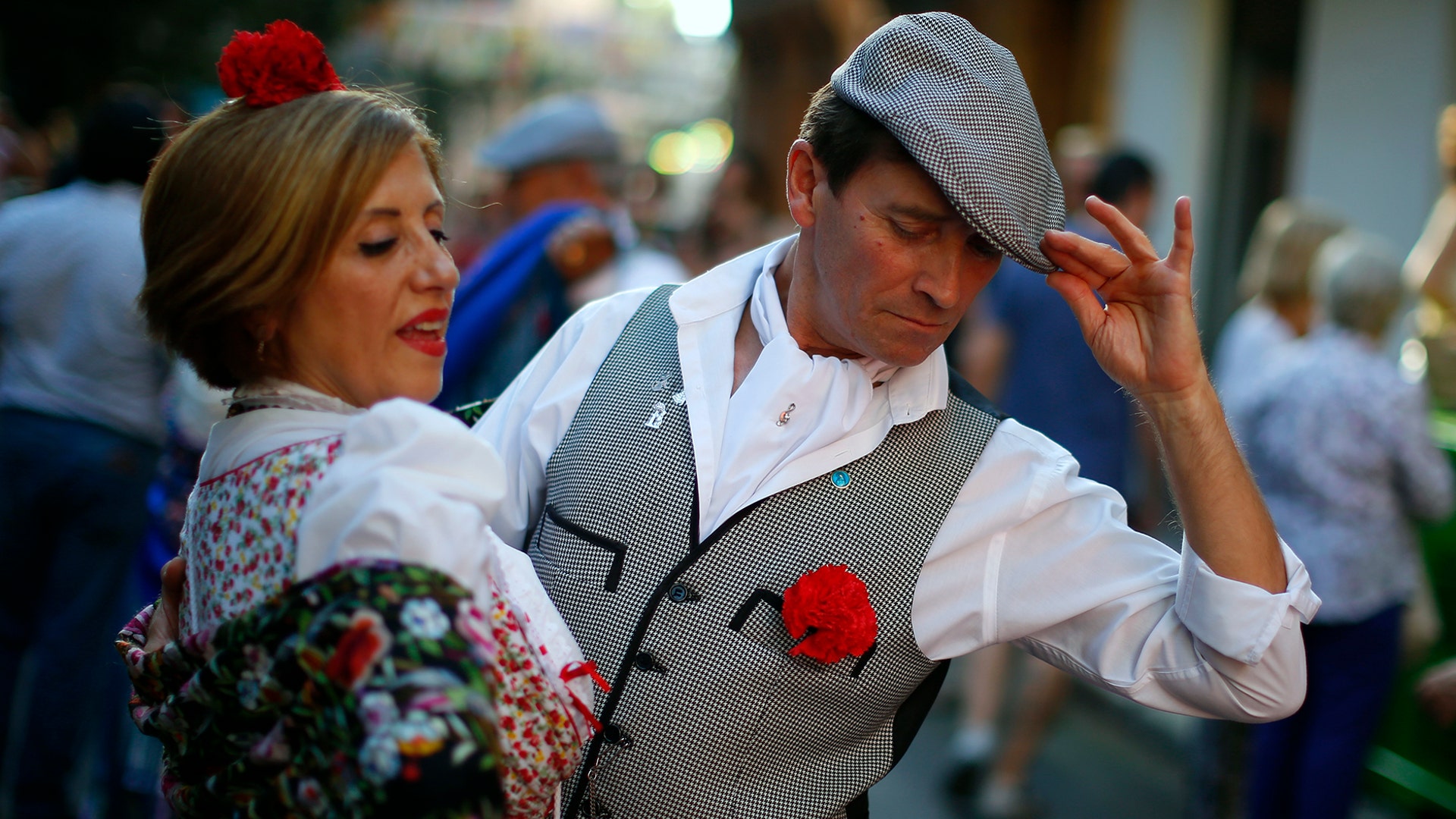 A couple dances during the Nuestra Senora de la Paloma festivities in Madrid, Spain, Aug. 14, 2019.