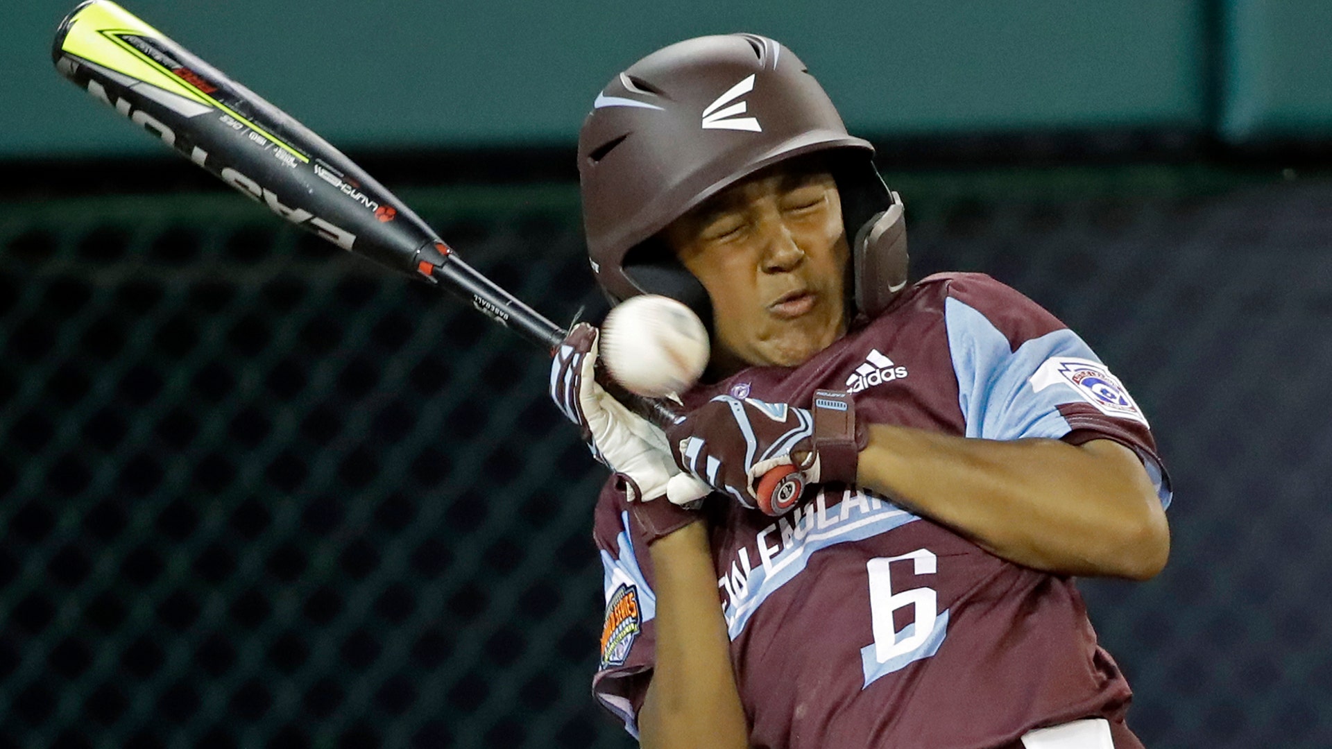 Barrington, R.I.'s Miles Fontaine is hit by a pitch from Elizabeth, N.J.'s Derek Escobar during their baseball game at the Little League World Series in South Williamsport, Aug. 20, 2019. 