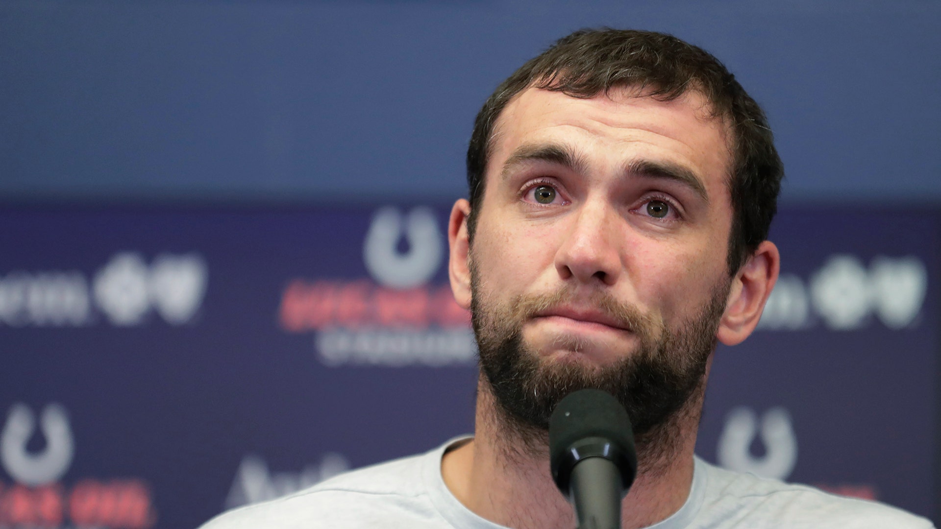 Indianapolis Colts quarterback Andrew Luck speaks during a news conference following the team's NFL preseason football game against the Chicago Bears, Aug. 24, 2019, in Indianapolis. The oft-injured star is retiring at age 29. 