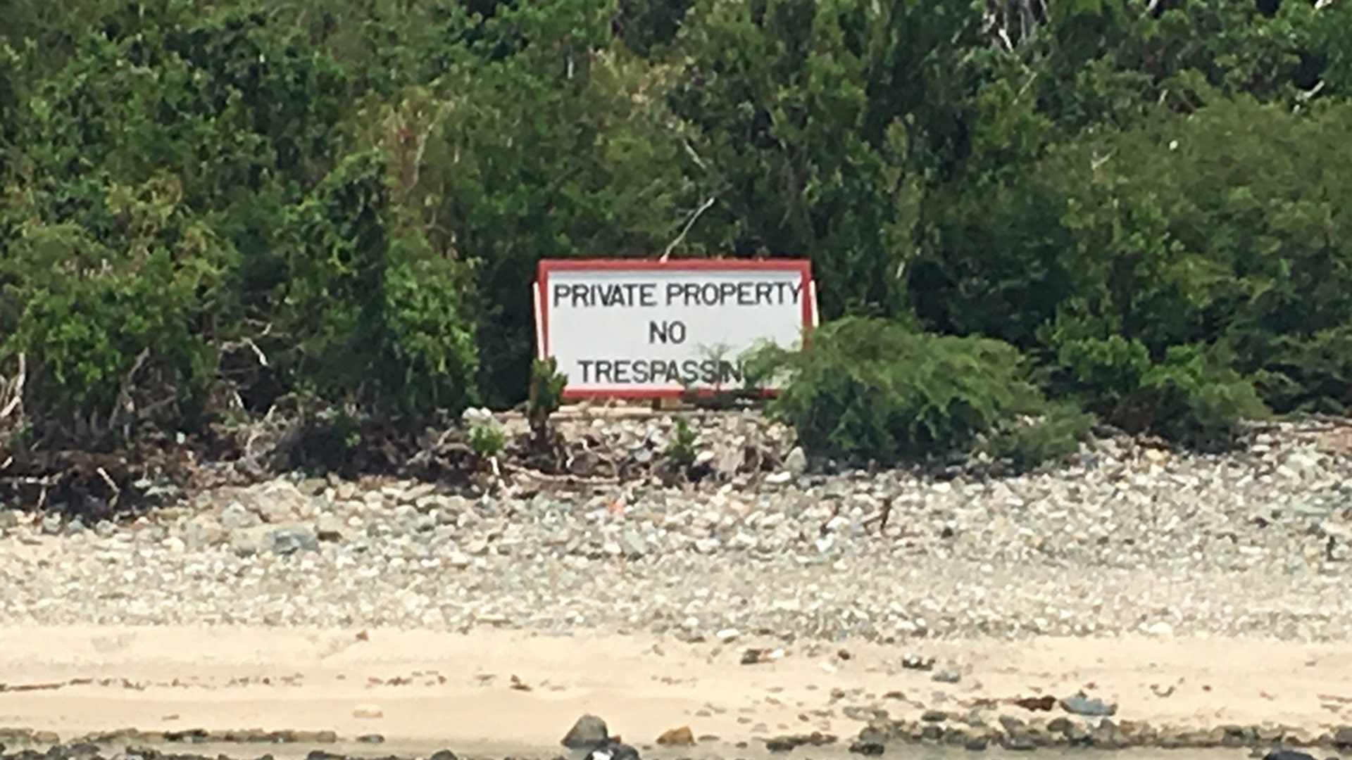 The red and white "private property" sign sits on Jeffrey Epstein's Little St. James Island in the U.S. Virgin Islands. Epstein bought the 73-acre retreat in 1998 for $7.95 million.