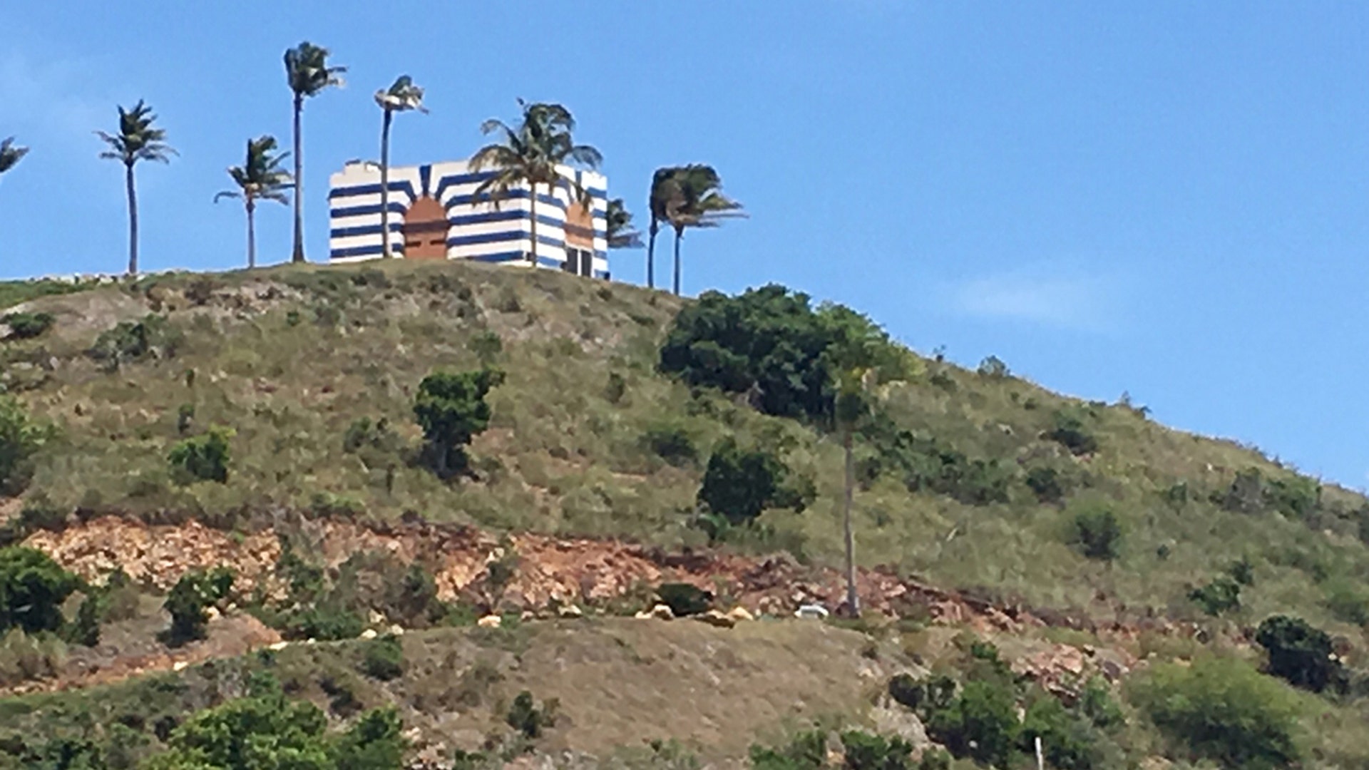 The blue and white striped structure is said to be a music room in Jeffrey Epstein's Little St. James Island. 