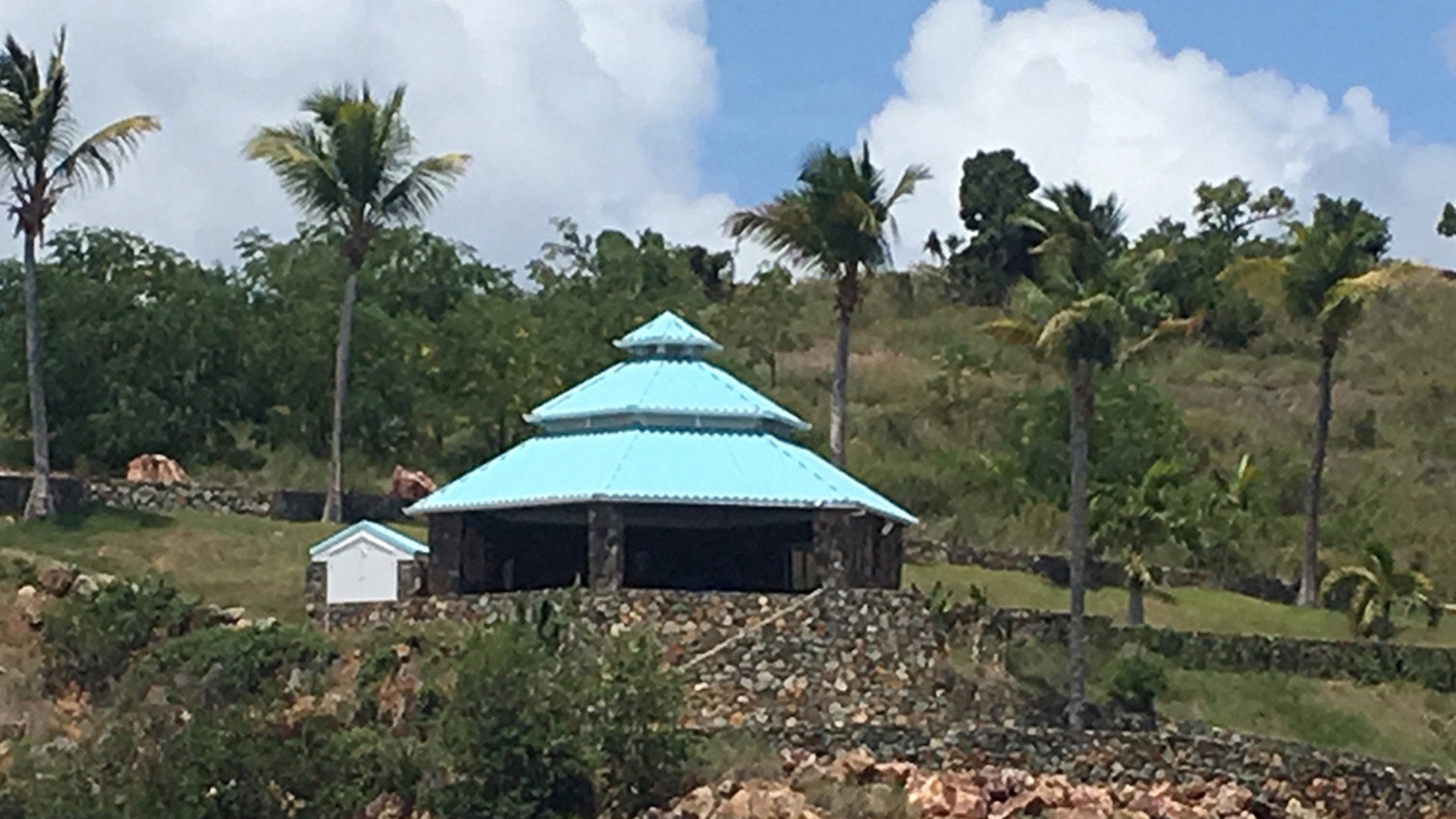 A circular stone structure and turquoise-blue roof is said to be an outdoor massage center on Jeffrey Epstein's Little St. James Island. 