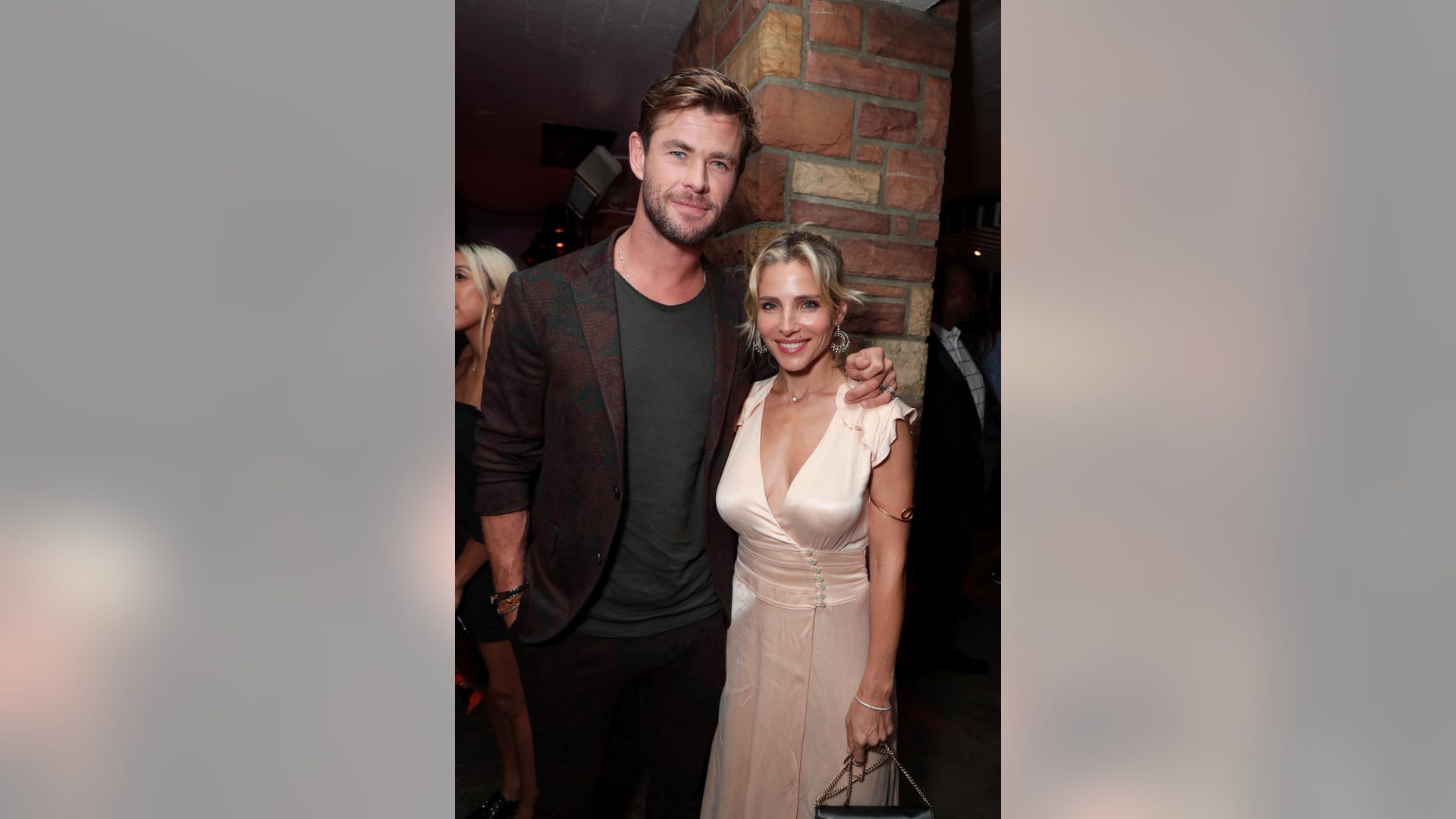 Elsa Pataky and Chris Hemsworth keep close at the premiere of  "Once Upon A Time In Hollywood" sponsored by Icelandic Glacial at the TCL Chinese Theatre in Los Angeles, Calif. on July 22, 2019.