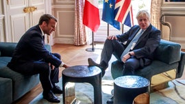 'Rude' Boris Johnson puts foot up on Elysee furniture during key Brexit talks with Macron