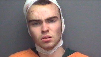 Suspected killer of minor league pitcher's family put on suicide watch as police detail gruesome murder scene