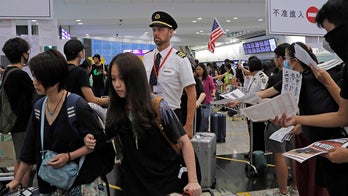 Hong Kong struggling to reopen airport day after pro-democracy demonstrations forced cancellation of flights