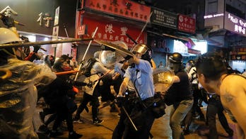 Hong Kong protest escalation: Tear gas, water cannons and a police officer firing a warning shot