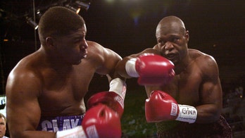 Former boxing star Clifford Etienne says he's cutting hair and painting in prison