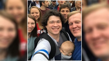 Russian couple face losing son, 1; prosecutors claim they endangered him by bringing him to violent protest