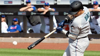 Miami Marlins' Isan Diaz hits first career home run while father is interviewed on TV