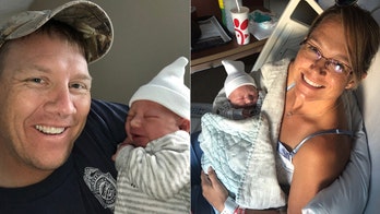 Navy dad catches newborn son while en route to hospital