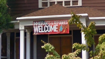 Members of liberal church mount loud protest against new priest who favors traditionalism: 'We are being abused'