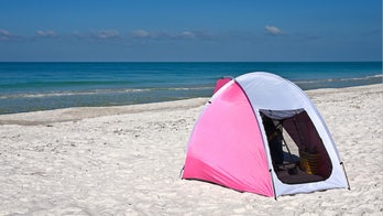 YouTube-famous parents slammed for leaving baby sleeping alone on beach while they swam