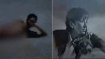 Police video from Jeffrey Epstein's Florida mansion appears to show pictures, some topless, of Ghislaine Maxwell