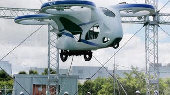 Futuristic flying car hovers above the ground for about a minute