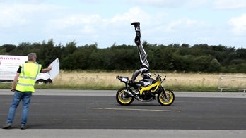 Motorcycle rider sets headstand record at 76 mph