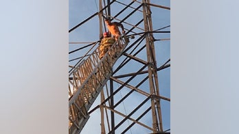 Naked man coaxed down from atop 150-foot Colorado power line tower, hospitalized